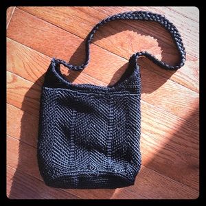 Woven black hand bag